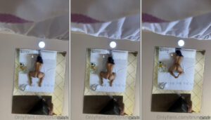Bruna Iork fazendo um strip-tease sensual e provocante de quatro na cama, exibindo seu bundão no espelho