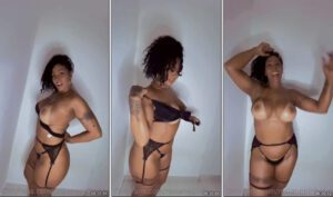 Rosiane Pinheiro fazendo strip com olhar sedutor no onlyfans