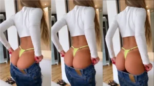 Vídeo da Mc Bragança se enrolando para vestir a calça por causa do bundão avantajado dela
